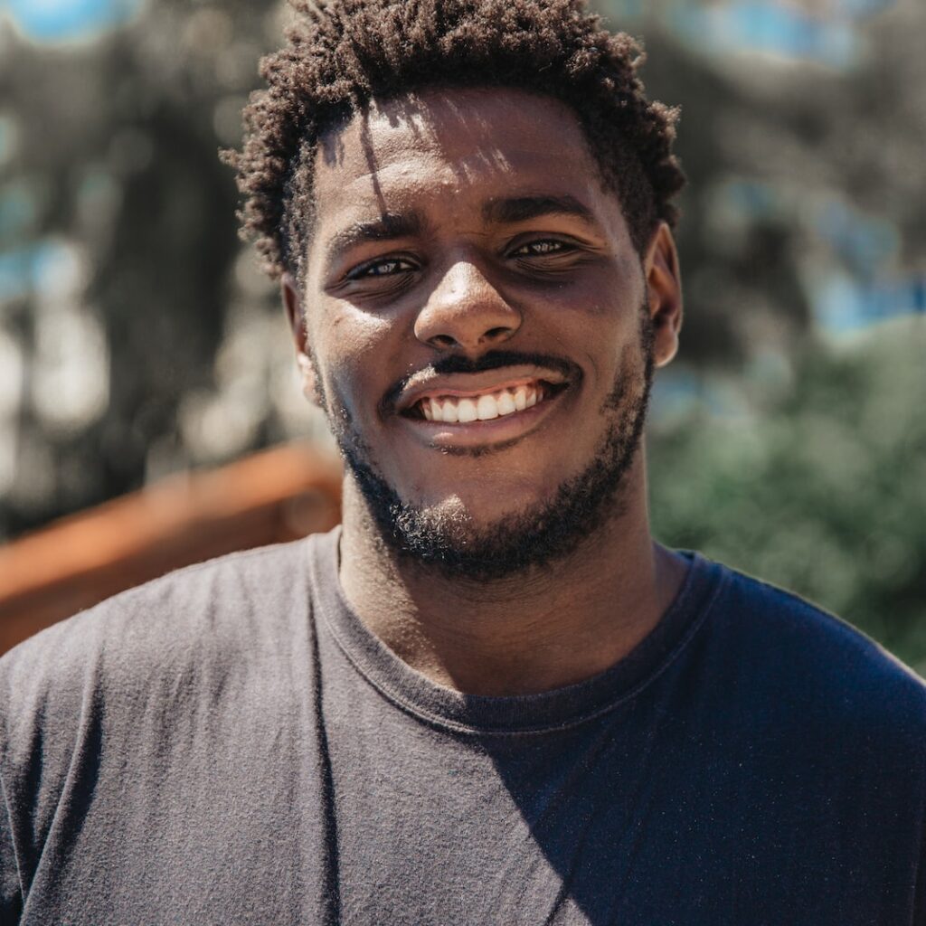 selective focus of man smiling during daytime